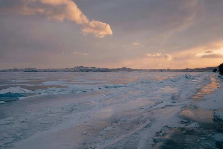 there is a person that is walking on the snow and ice