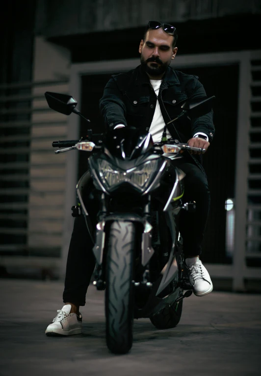 a man that is sitting on a motorcycle