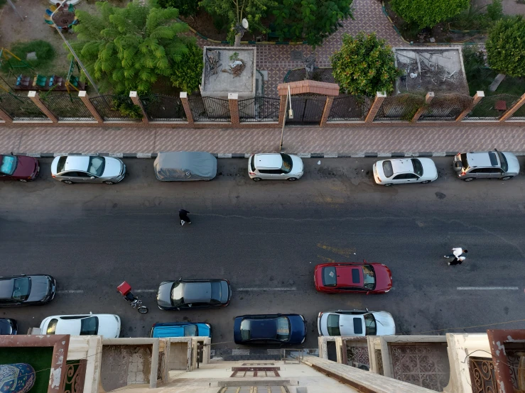 a picture of a city street with vehicles