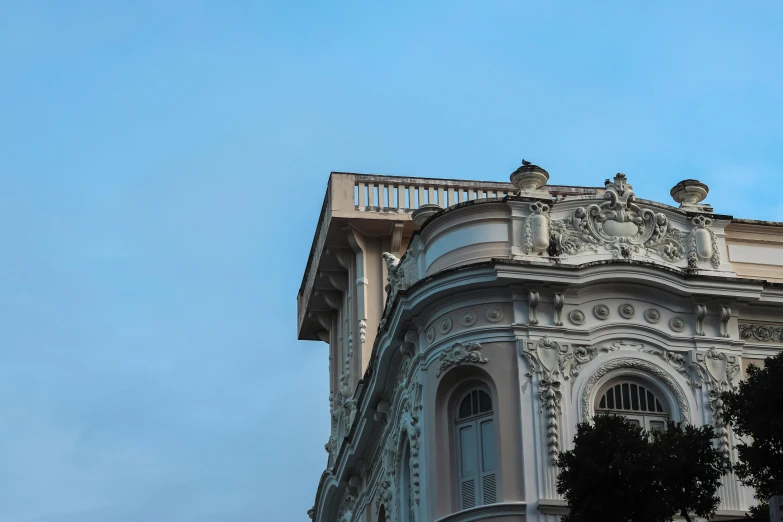 an old building with balcony balconies is against the blue sky