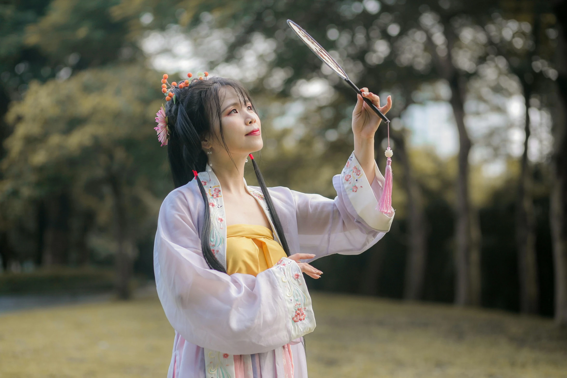 an asian woman with ids and a sword