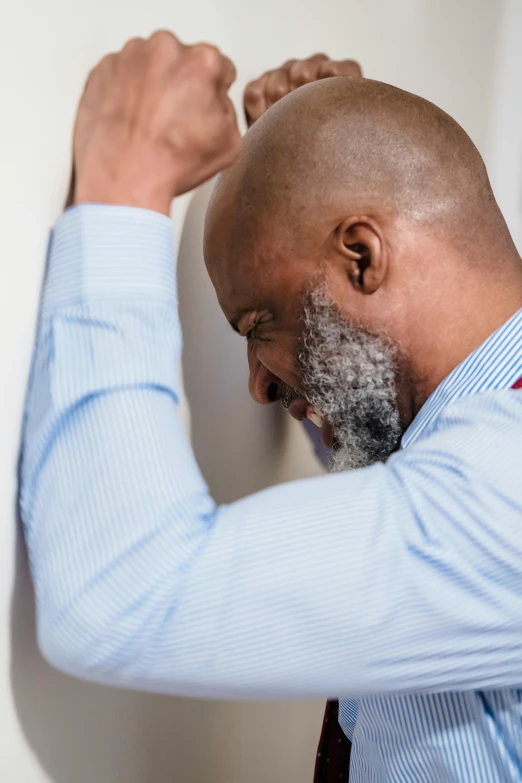 an image of a bald man brushing his hair