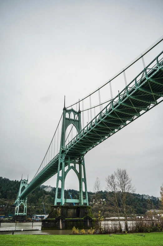 a suspension bridge is very large over water