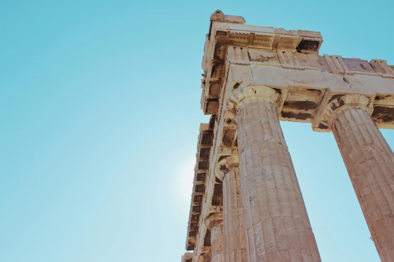 a very tall stone structure sitting underneath a blue sky