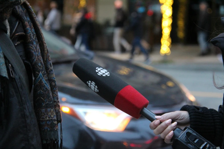 a woman with a microphone on her hand