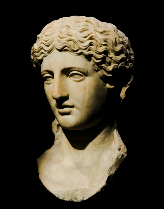 an ancient greek bust of a young woman