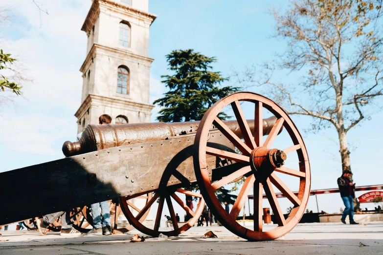 a wooden wagon sitting on the side of a road