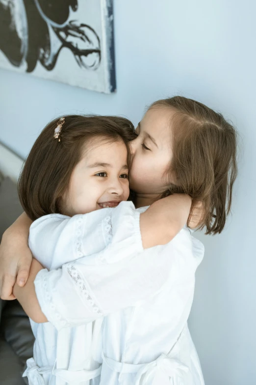 two girls hugging and cuddling each other