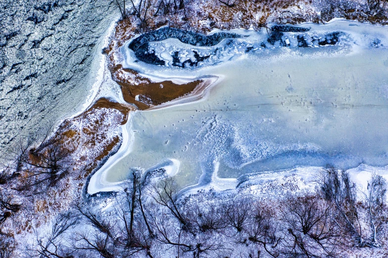 the snow is covered with ice and brown colors