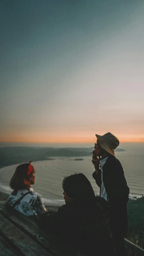 two people are taking pictures at the overlook