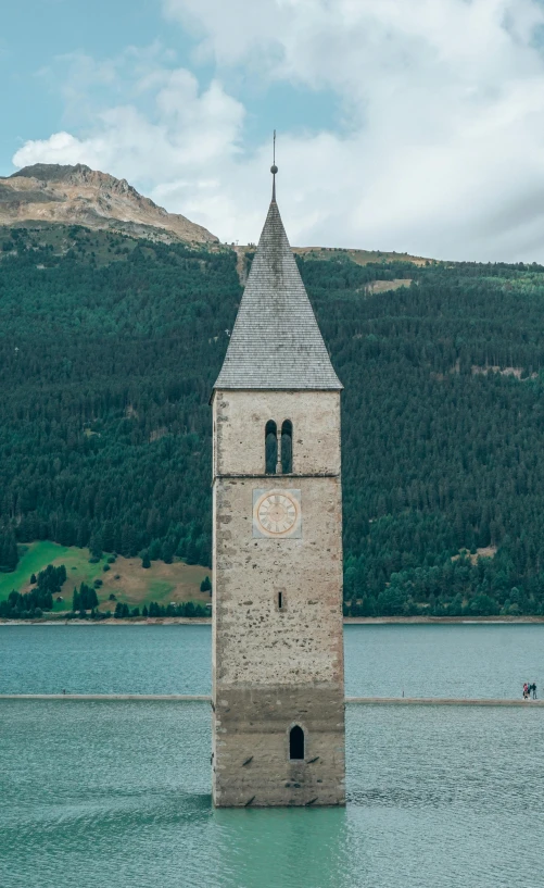 a tower that has a weather vane at the top of it