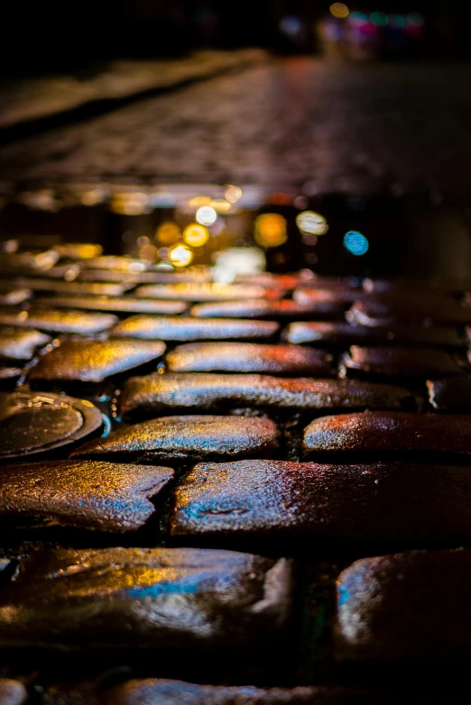 a pavement is lit by colorful lights on it