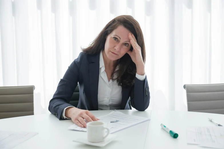 the business woman in the office is tired