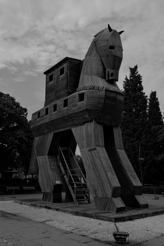 the large statue of a horse is outside