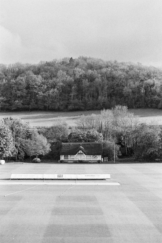 black and white po of a bench near the street