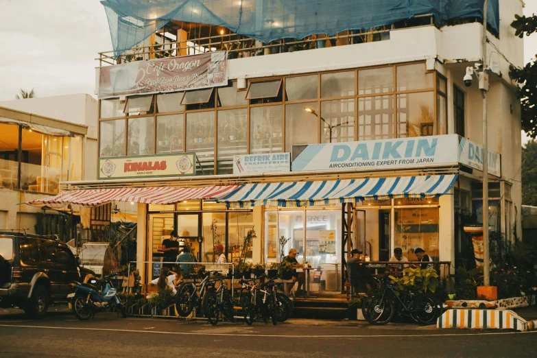 the shop has many bicycles in front of it