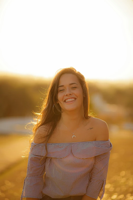 a woman smiling and posing for the camera