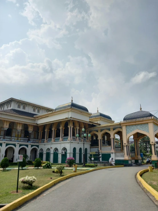 a large building with a very long driveway