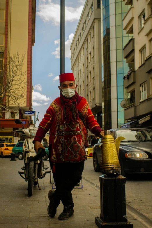 a man wearing a mask walking down the street