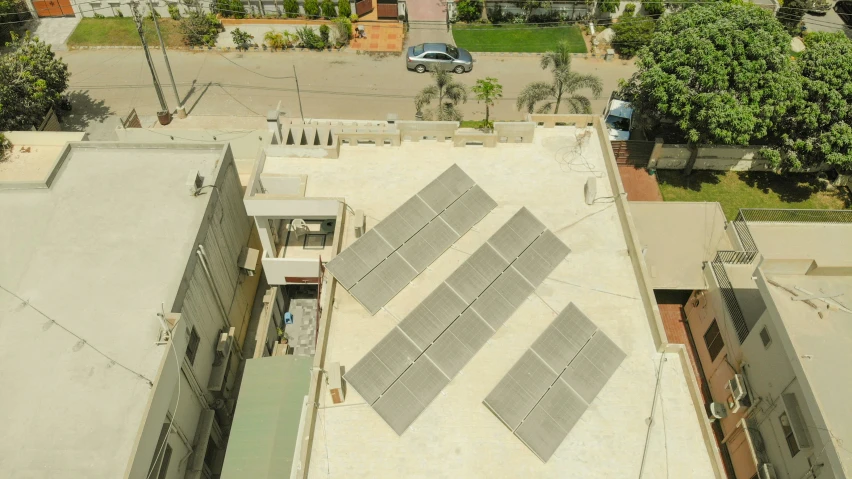 aerial view of rooftop and buildings with a car parked by the top