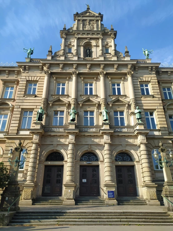 an old building that looks like it has stairs up to the door