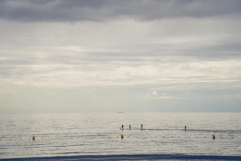 there are two people on boards riding the waves in the ocean