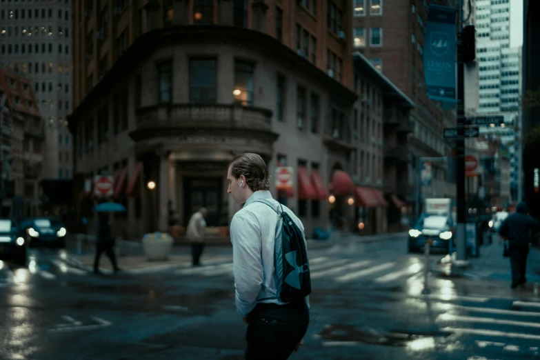 a man is walking on a street corner