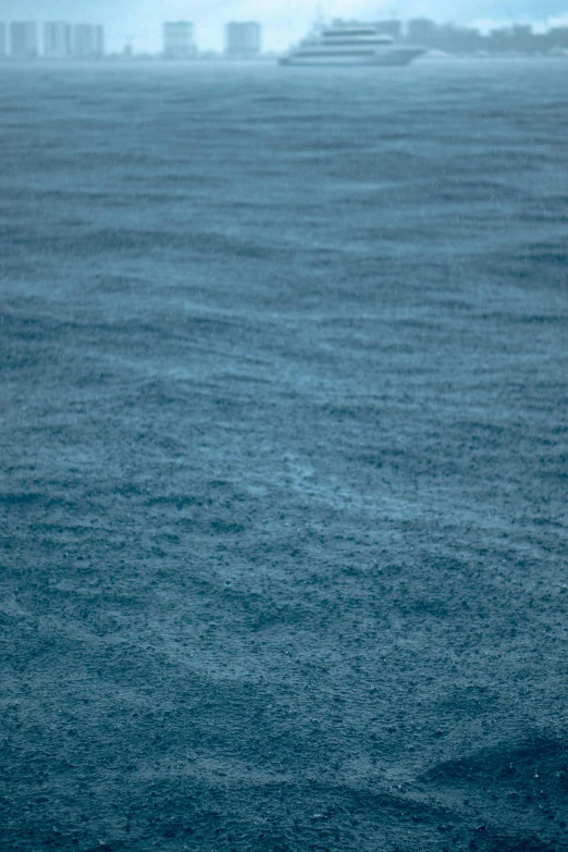 a person is holding a surfboard in the ocean