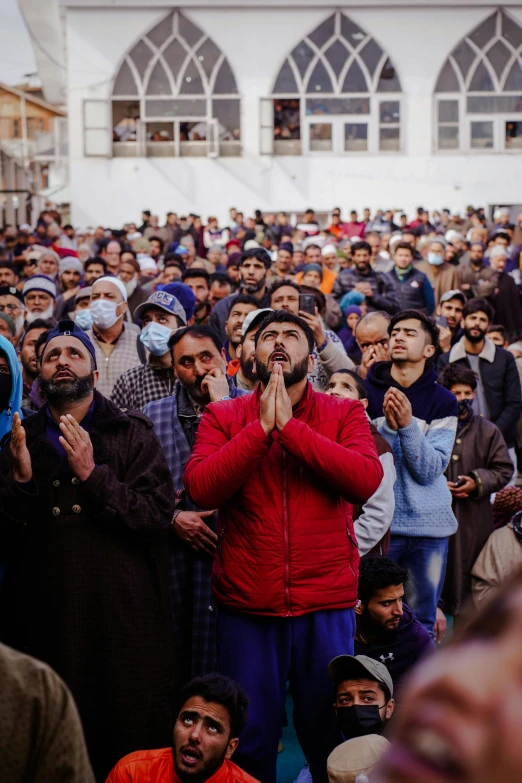 a large group of people wearing masks