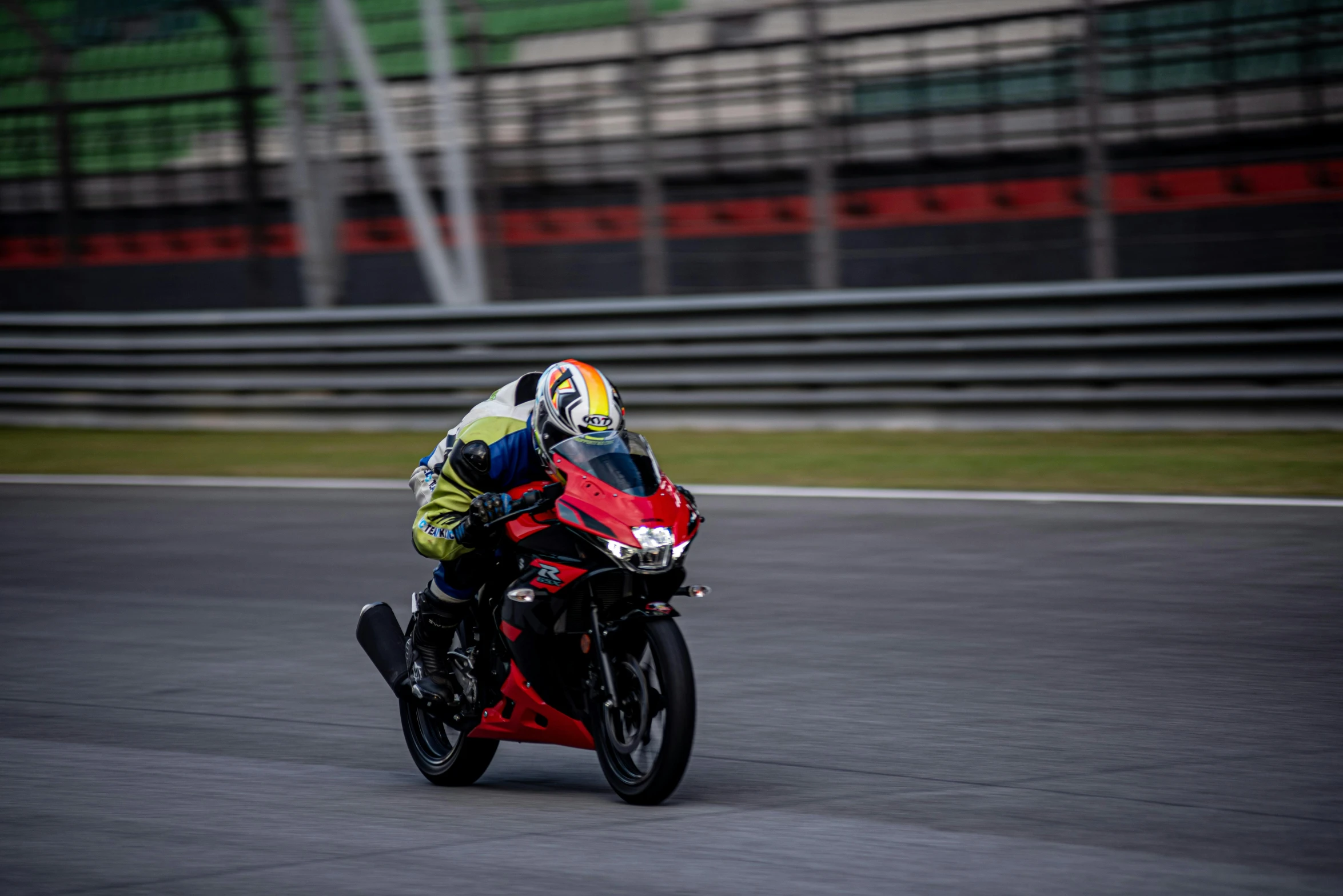 a person on a motorcycle riding around the track