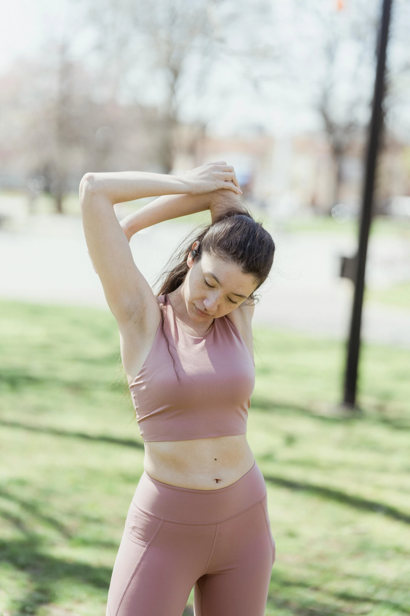 a woman doing a stretching exercise with her arms and hands