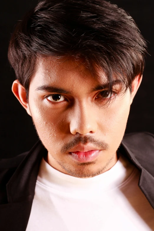 a close - up image of a man with a goatee and goatee mustache