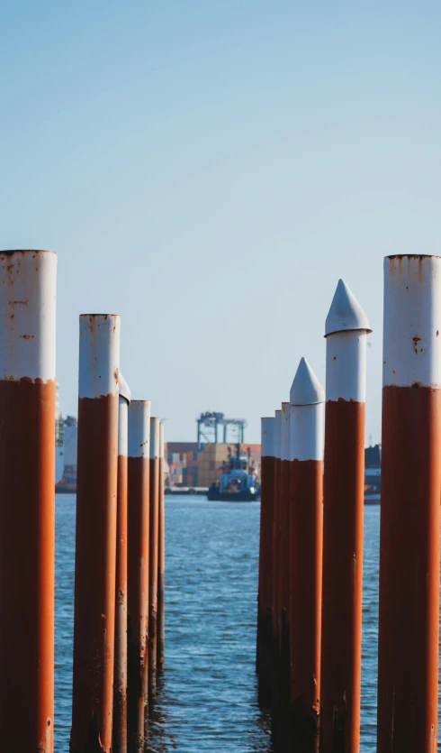 a bunch of poles sticking out of the water