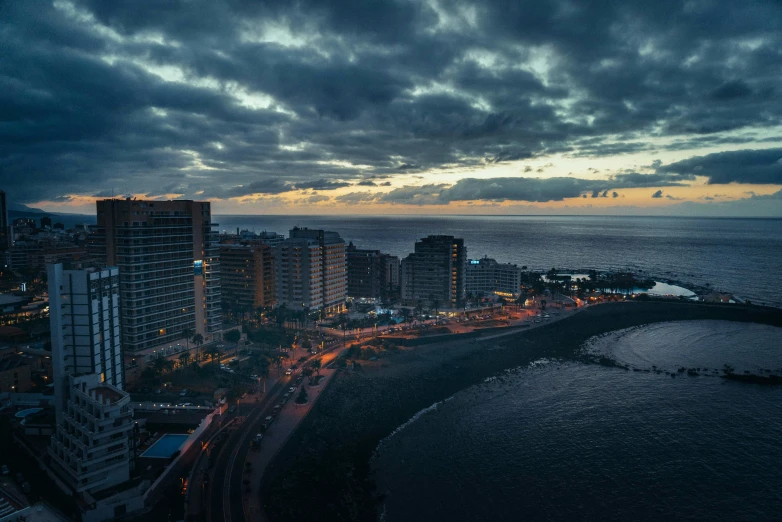 a wide view of an ocean with tall buildings