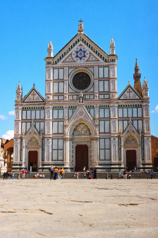 several people standing in front of a church