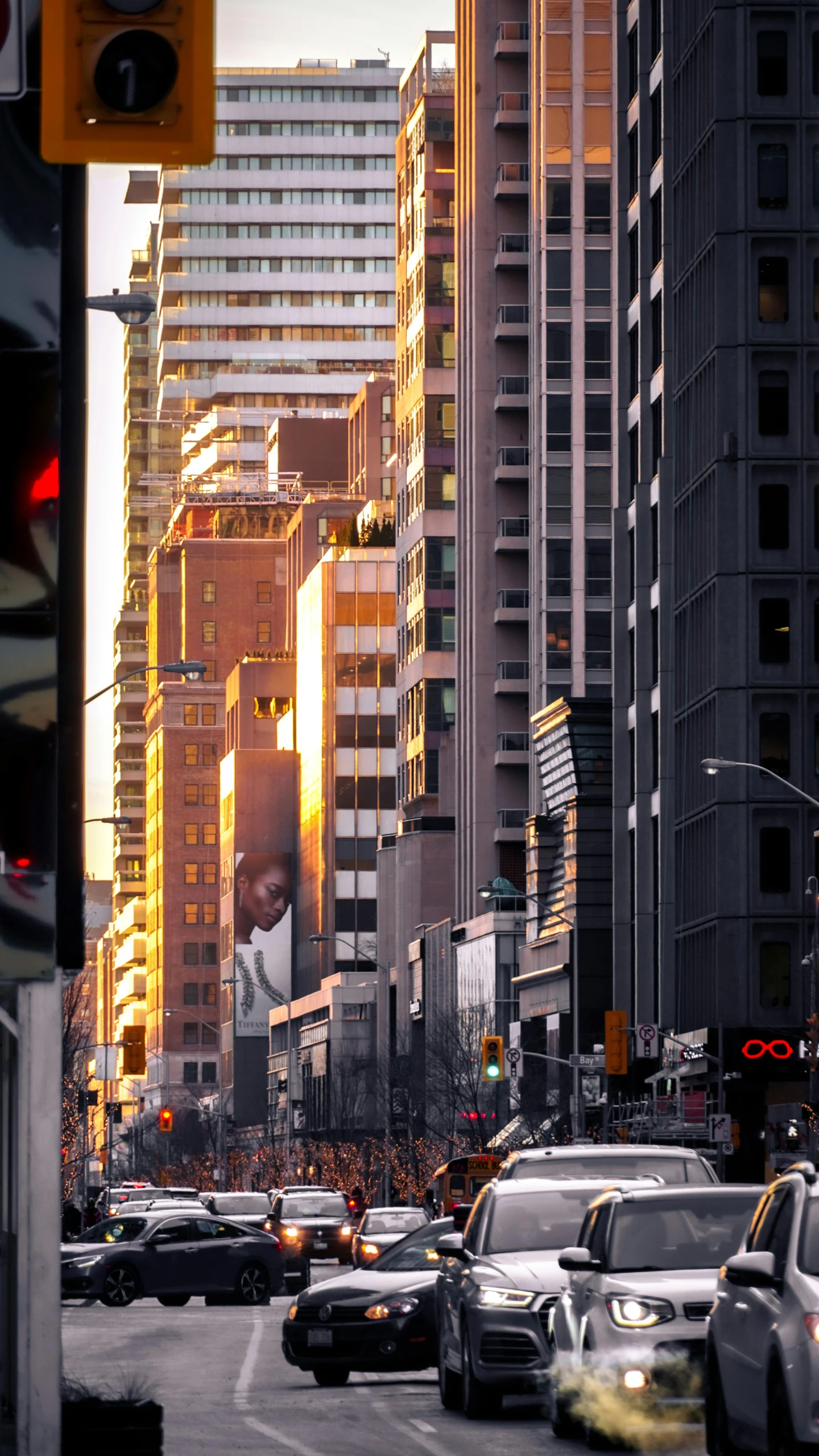 a busy street with many buildings in the city