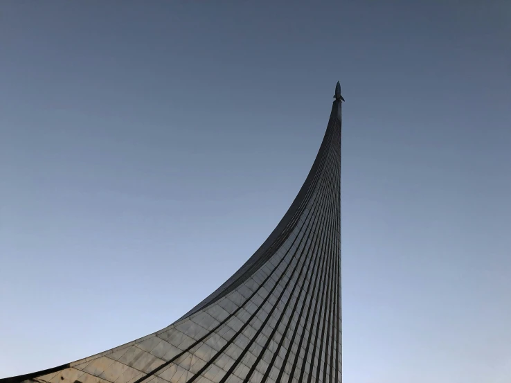 an image of a very large building with the sky in the background