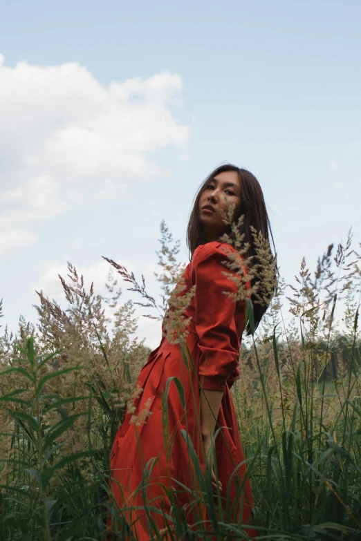 an african american woman posing in a field