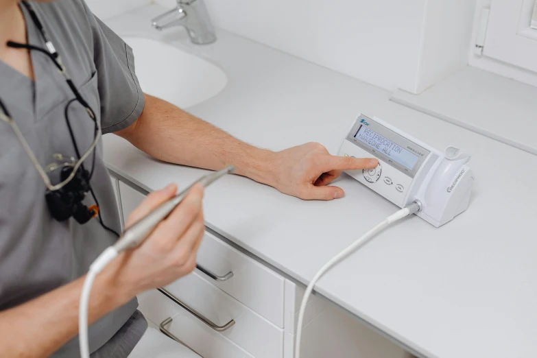 a man is working on his radio in the bathroom