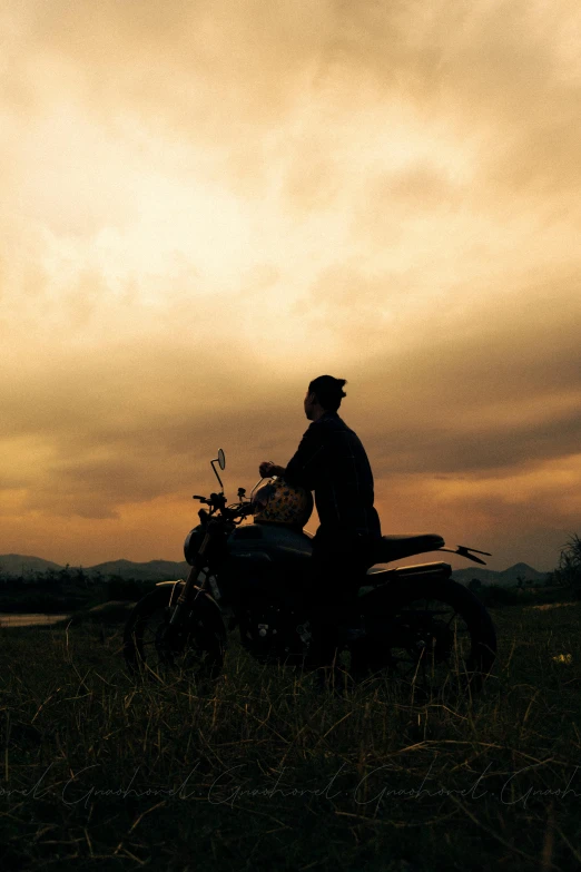 a man that is sitting on a motorcycle