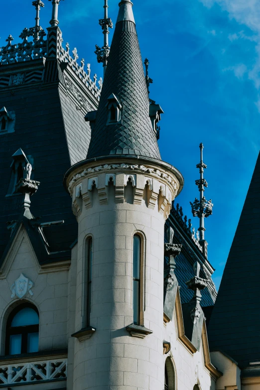 an old castle with turrets has a clock