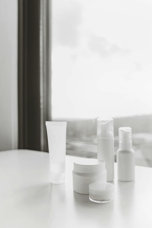 several white bottles on top of a table