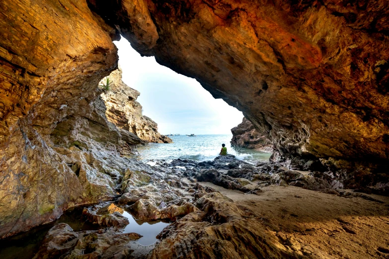 a cave is partially closed in to the water