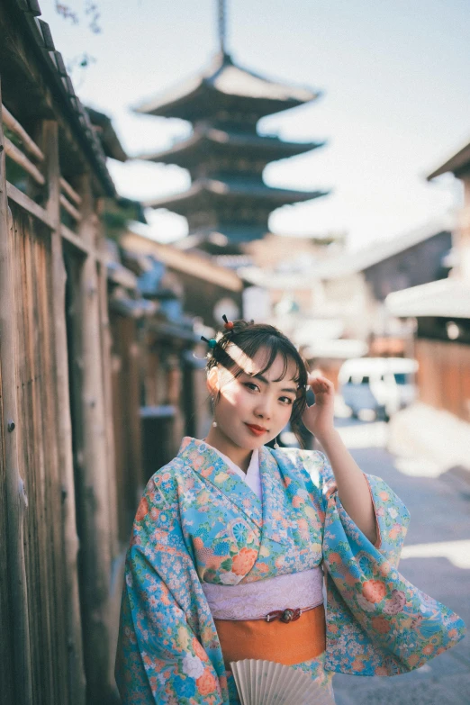 an asian woman standing in the middle of a street