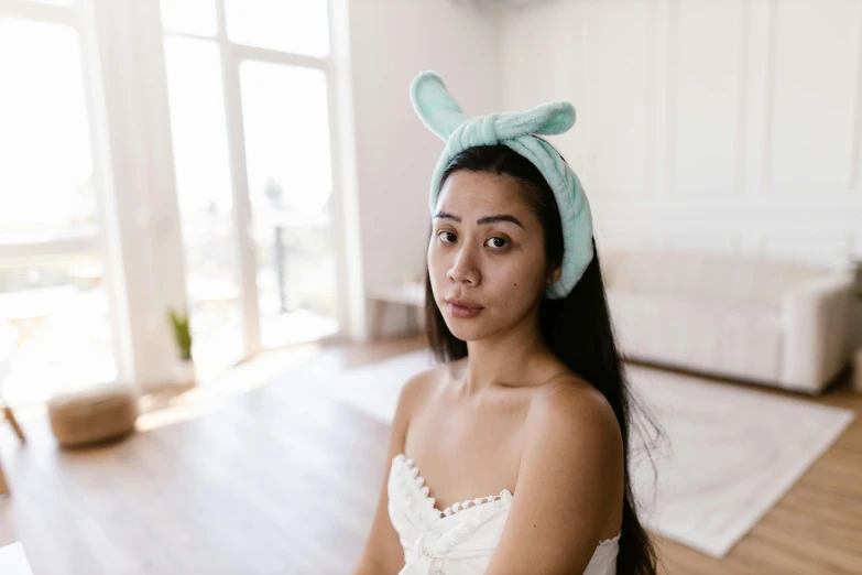 a woman in a bunny ears head band