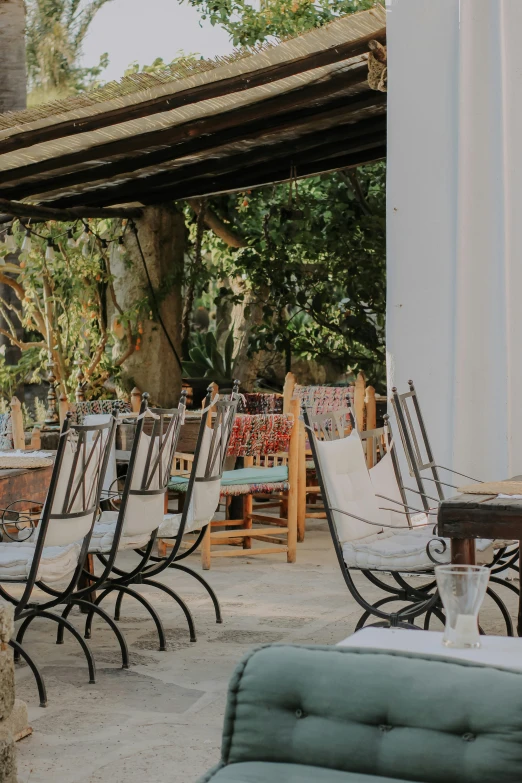 tables and chairs are set up outside on an outdoor patio