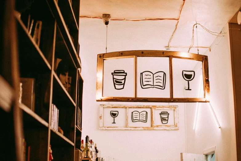 a bar with wine glasses hanging over it