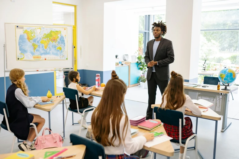 a man in business suit giving a class