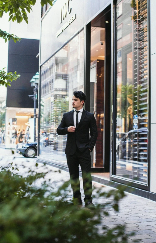 a man standing in front of a large store