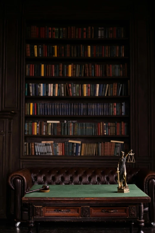 a bench with a desk in front of a liry full of books